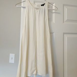 Flowy white tank with small slit in back